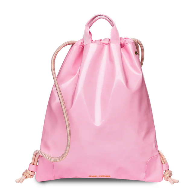 BLush1 Front view of a pink drawstring backpack with cream rope straps on a white background, city-ready style